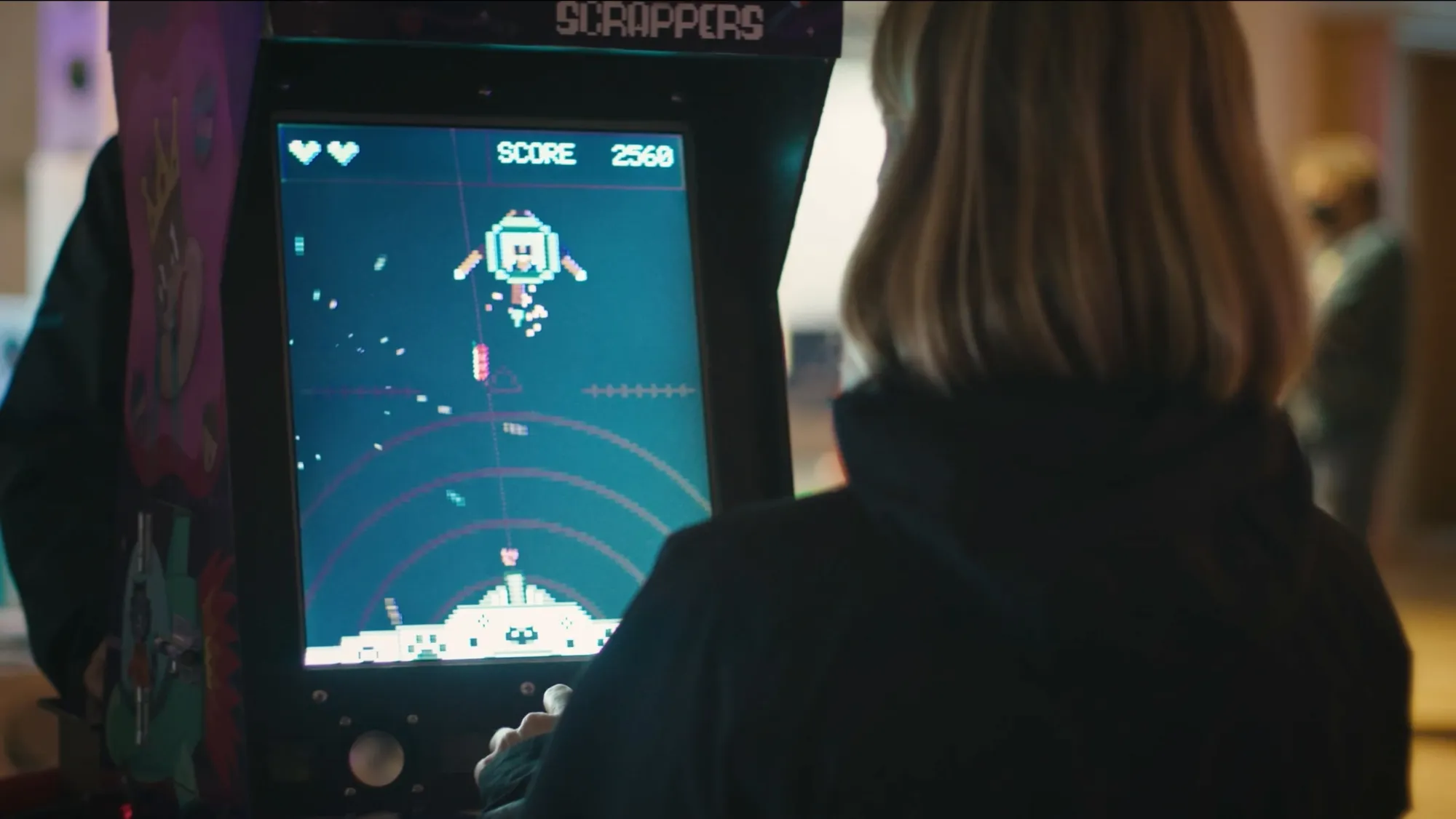 Student playing arcade style game