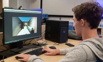 A student is creating a game design project