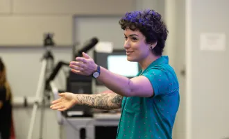 Summer Design Camp Director Jessie Contour introducing projects during the Summer 2022 Game Design Camp Showcase