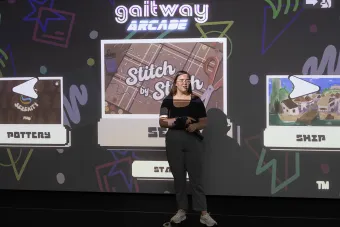 AET student Ella Gault presents about her game onstage