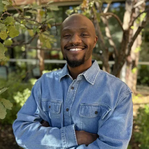 Headshot of Gary Young smiling in an outdoor setting