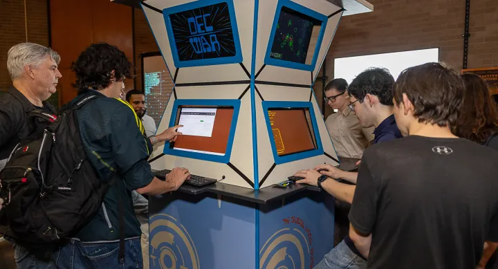 AET students play a game in a display with an Armadillo World Headquarters-inspired design